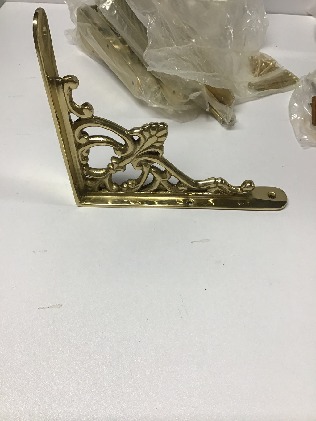 Brass shelf bracket