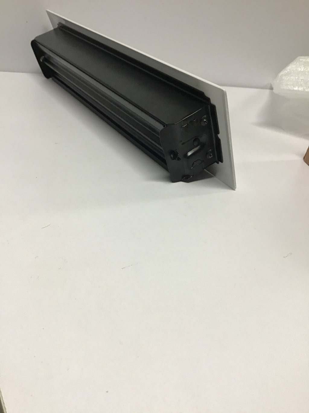 White ornate heating/cooling vent